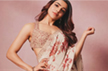 Samantha Ruth Prabhu drapes a beige chiffon saree with bursts of printed red blooms